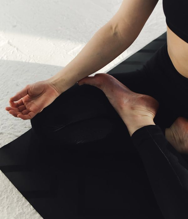 Woman in a serene yoga pose, embodying inner peace and tranquility.